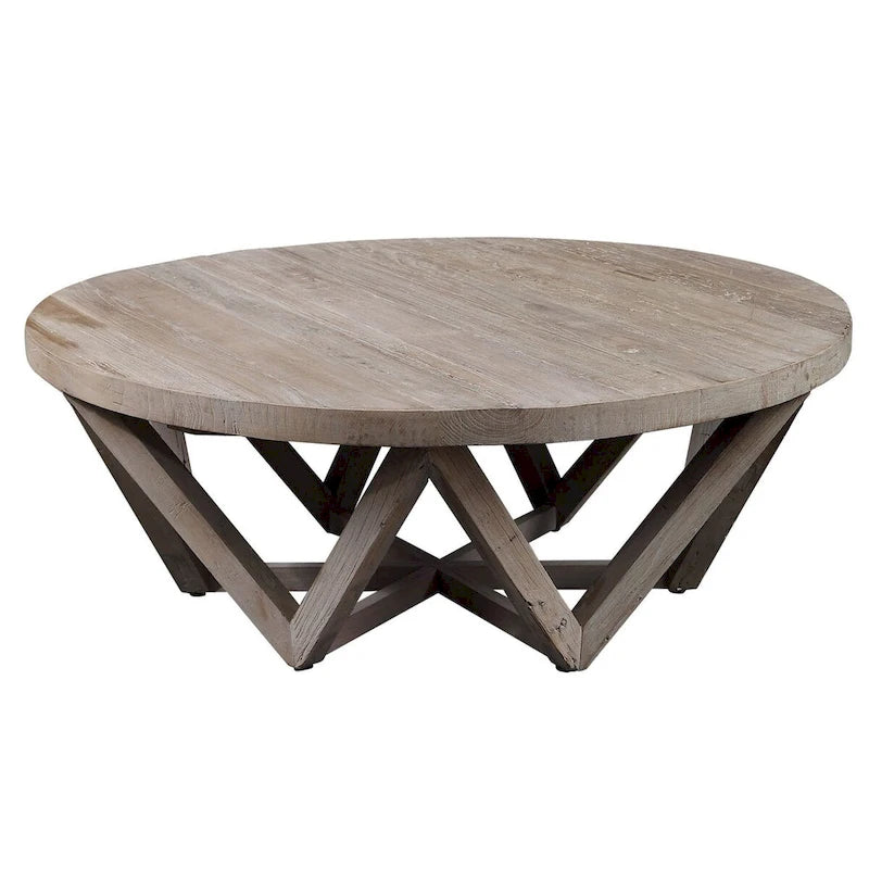 Mesa de centro redonda de olmo natural, base geométrica, con capacidad para 4–6 personas